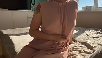 A Sensual Girl In A Pretty Pink Dress Indulges In Self-Pleasure